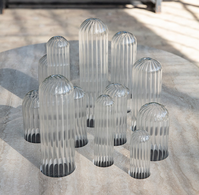 Oval coffee table Cactus by Mickaël Koska, striated Pyrex glass legs and travertine top. Sculptural piece from the Cactus collection, made in Marseille partner workshops, for Caroline Andréoni.