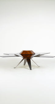 La Table basse Starsky par HERVET Manufacturier, palissandre Dos Santos, inox massif et verre modulable, inspirée de Saturne, fabriquée en France.