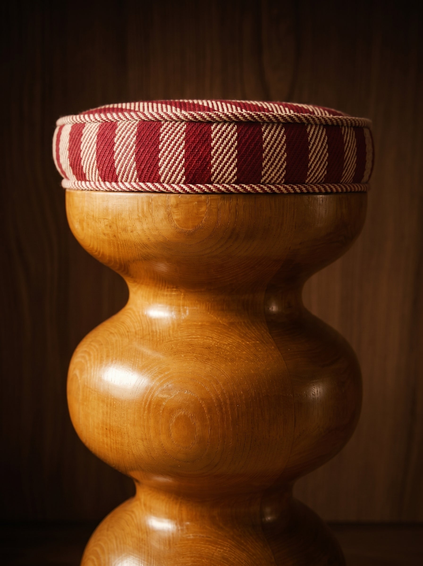 High stool Yoko by Romie Objetti, hand-sculpted by Alice Damiens in stained oak, exclusively for Caroline Andréoni. Undulating forms, beeswax finish, available in one wave or two waves.