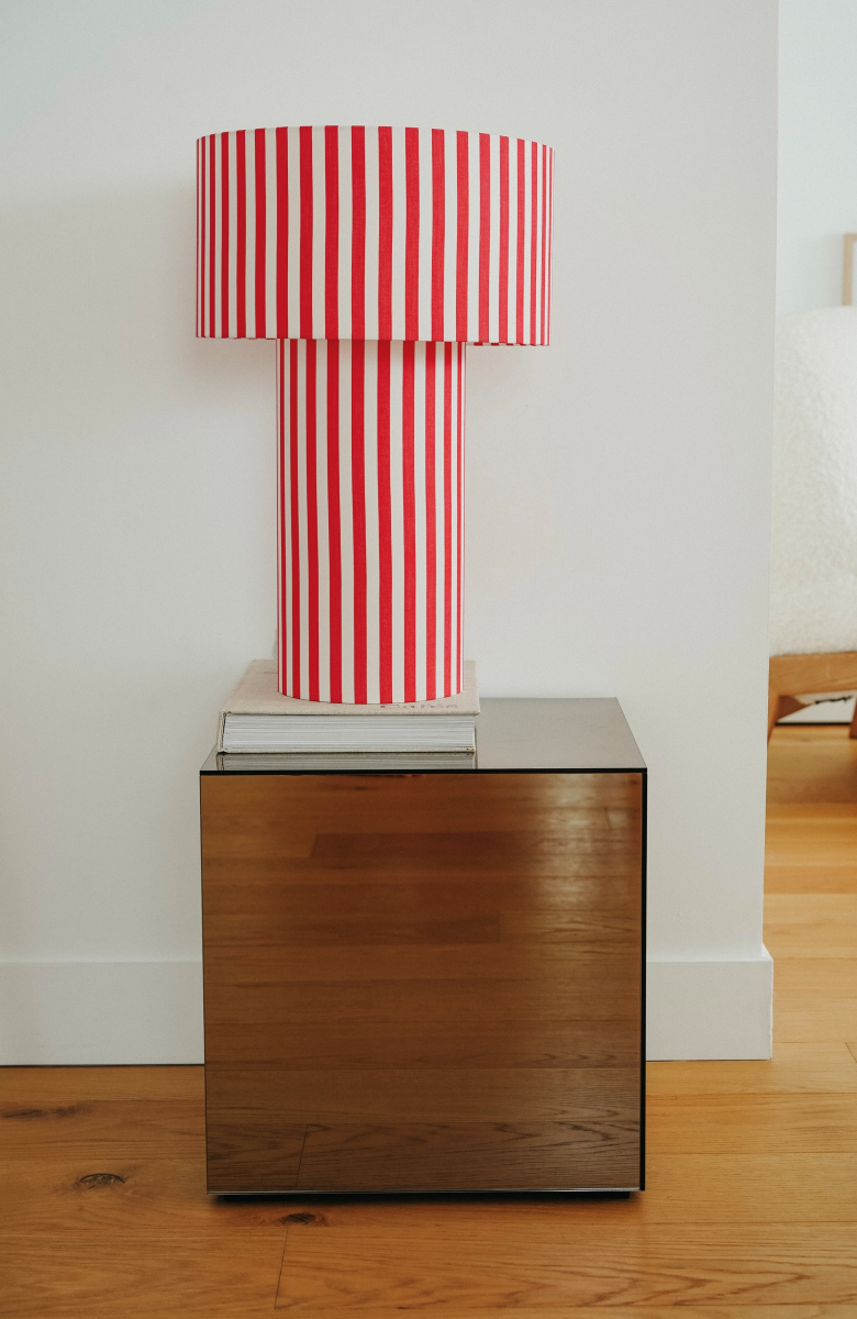 Table lamp Octaveo Rouge in white-and-red striped cotton by My Leone. Handmade by Marine and her mother in the Vannes atelier. The tube lampshade becomes the base, bold and artisanal.