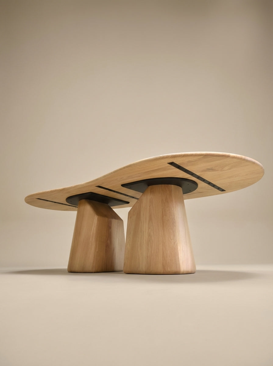 Dining table Elmer by Thomas Coup La Fronde, rounded light oak top on hand-sculpted monolithic legs. Sculptural, organic design, crafted in Lyon for 8 to 10 guests.