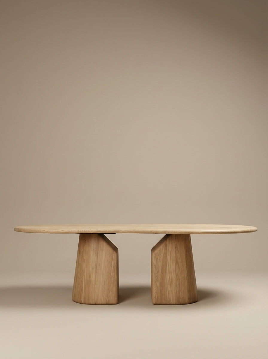 Dining table Elmer by Thomas Coup La Fronde, rounded light oak top on hand-sculpted monolithic legs. Sculptural, organic design, crafted in Lyon for 8 to 10 guests.